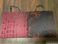 Front view of both panels side by side showing patterns and ribbon hangers