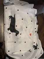 Folded dachshund-print shower curtain