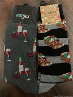 Both pairs in packaging, tags visible Hot Sox and K. Bell