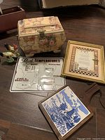 Group shot showing all items: recipe box, wall art, rooster shakers, tile trivet, meat temperature sign