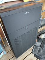 Front and side view of black RespirAide air purifier