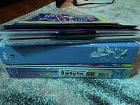 Side stack view showing binders, dividers packs, folders