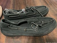 Side view of both shoes showing uppers, laces and overall condition