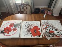 Group view of all three canvas prints on table