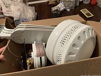 Ceiling fan motor housing and stacked blades in box