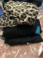 Stacked dresses showing fabrics and colours