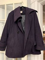 Front view of deep purple Jessica peacoat on hanger