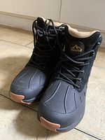 Front view of both boots showing uppers and lacing