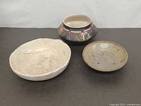 Three bowls grouped for size and colour comparison