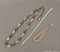 Full view of necklace and two bracelets