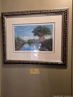 Full view of framed print on wall showing frame, mat and artwork