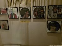 Wall display showing six of the framed picture-disc records