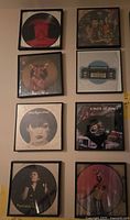 Wall view of all eight framed picture-disc records