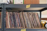 Shelf with tight row of LP records; Nat King Cole spine visible