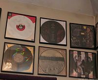 Overall view of all six framed picture discs on wall