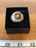 Ring in presentation box showing top face with maple leaf logo