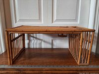 side view showing bamboo frame, spindle sides and folding legs