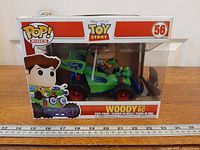 Front angled view of boxed Funko Pop! Rides Woody with RC #56