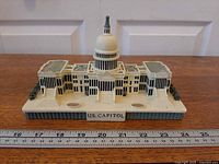 Front view showing plaque "U.S. CAPITOL", overall façade and size reference