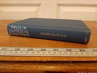 Spine view with title, author, publisher and ruler for scale