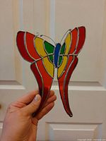 Front view of stained glass butterfly held up
