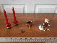 All six items lined on table with ruler for scale