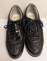 Top view of both shoes showing overall style, lace system and glitter finish