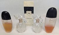 Front view of four La Perla perfume bottles and original box