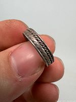 Side view showing braided rope design on ring