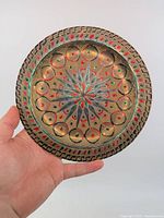 Full view of brass enamel plate front side