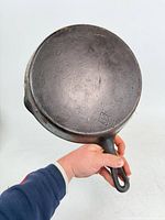 Full view of underside showing diamond logo and overall patina