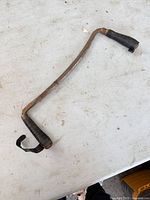 Full view of drawknife showing blade and taped handles