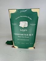 Front of Love's Cabin comforter set box