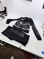 Tracksuit hoodie and pants laid flat