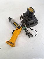 Cordless screwdriver, battery pack seated on charger