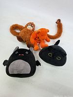 Group shot of four plush toys