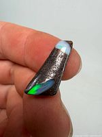 Oblique view showing green-blue opal vein in brown matrix