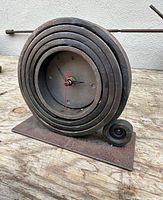 Front view showing spiral coil and clock face