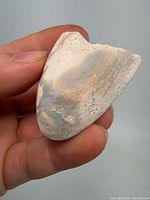 Front view of opal boulder showing colorful opal vein