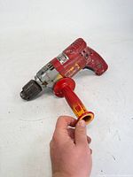 Milwaukee drill with side handle detached