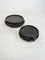 Two carved wooden stands top view