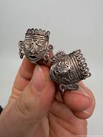 Front view of both Aztec mask earrings