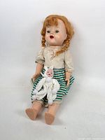 Full view of both dolls, showing size difference and outfits