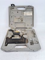 Nailer and case open showing full contents