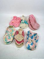 All six pairs of crocheted slippers displayed