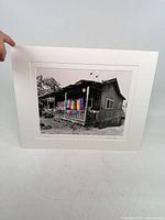 Full view of matted photograph showing image and mat