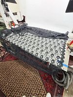Full view of black lace fabric draped on table