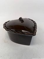 Three-quarter view showing heart-shaped covered dish