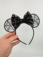 Full view of headband showing ears and bow