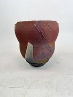 Front view showing glaze colors, texture and incised motif